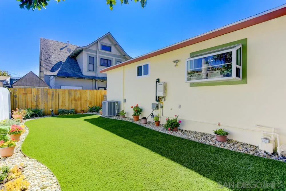 1221 4th Street Coronado, CA 92118 - Photo 11 of 24 a front view of a house with a garden
