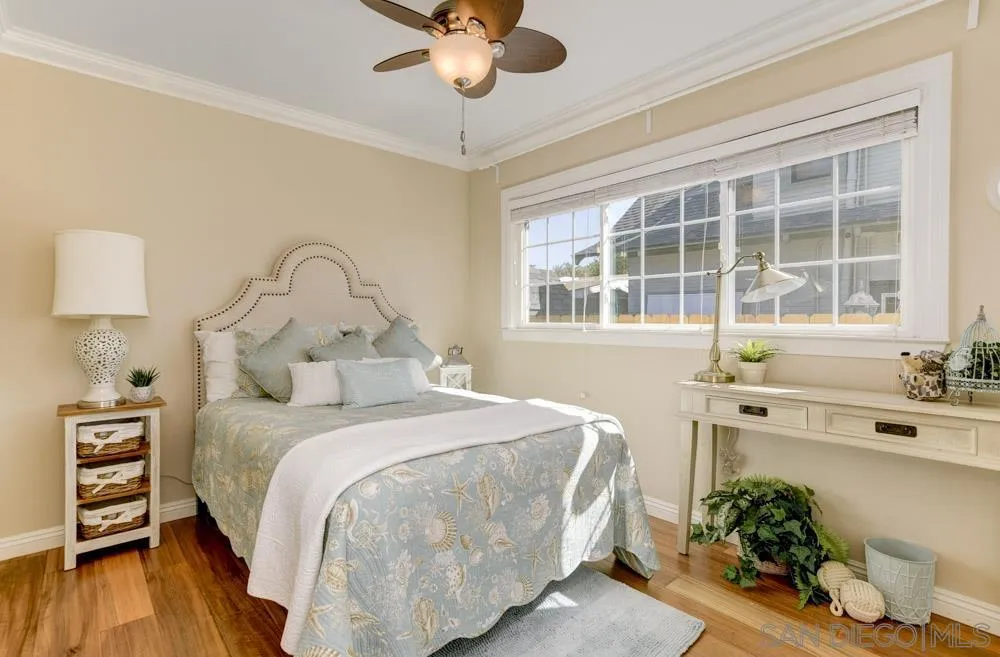 1221 4th Street Coronado, CA 92118 - Photo 14 of 24 a bedroom with a bed and a large window