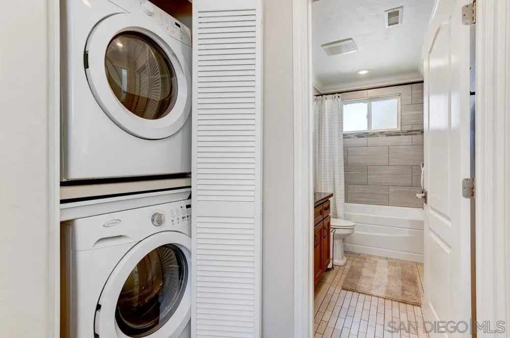 1221 4th Street Coronado, CA 92118 - Photo 22 of 24 a view of a hallway with washer and dryer