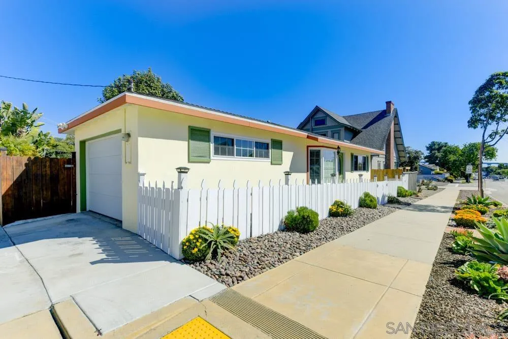 1221 4th Street Coronado, CA 92118 - Photo 24 of 24 a front view of a house with garden