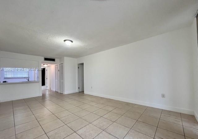 14155 Southwest 87th Street, Unit E310 Miami, FL 33183 - Photo 4 of 13 a view of an empty room