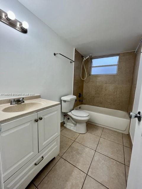14155 Southwest 87th Street, Unit E310 Miami, FL 33183 - Photo 10 of 13 a bathroom with a sink a toilet and shower