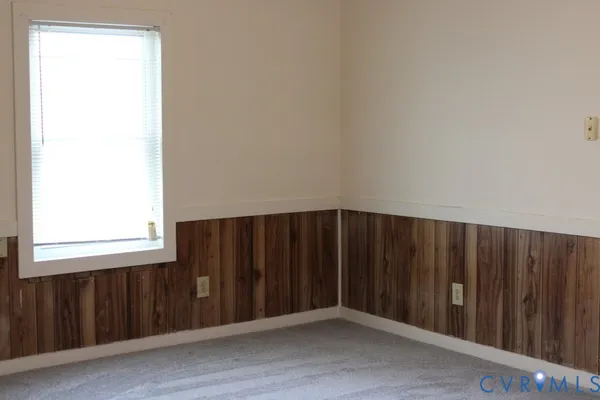 an empty room with wooden floor