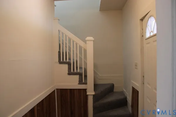 a view of entryway with wooden floor
