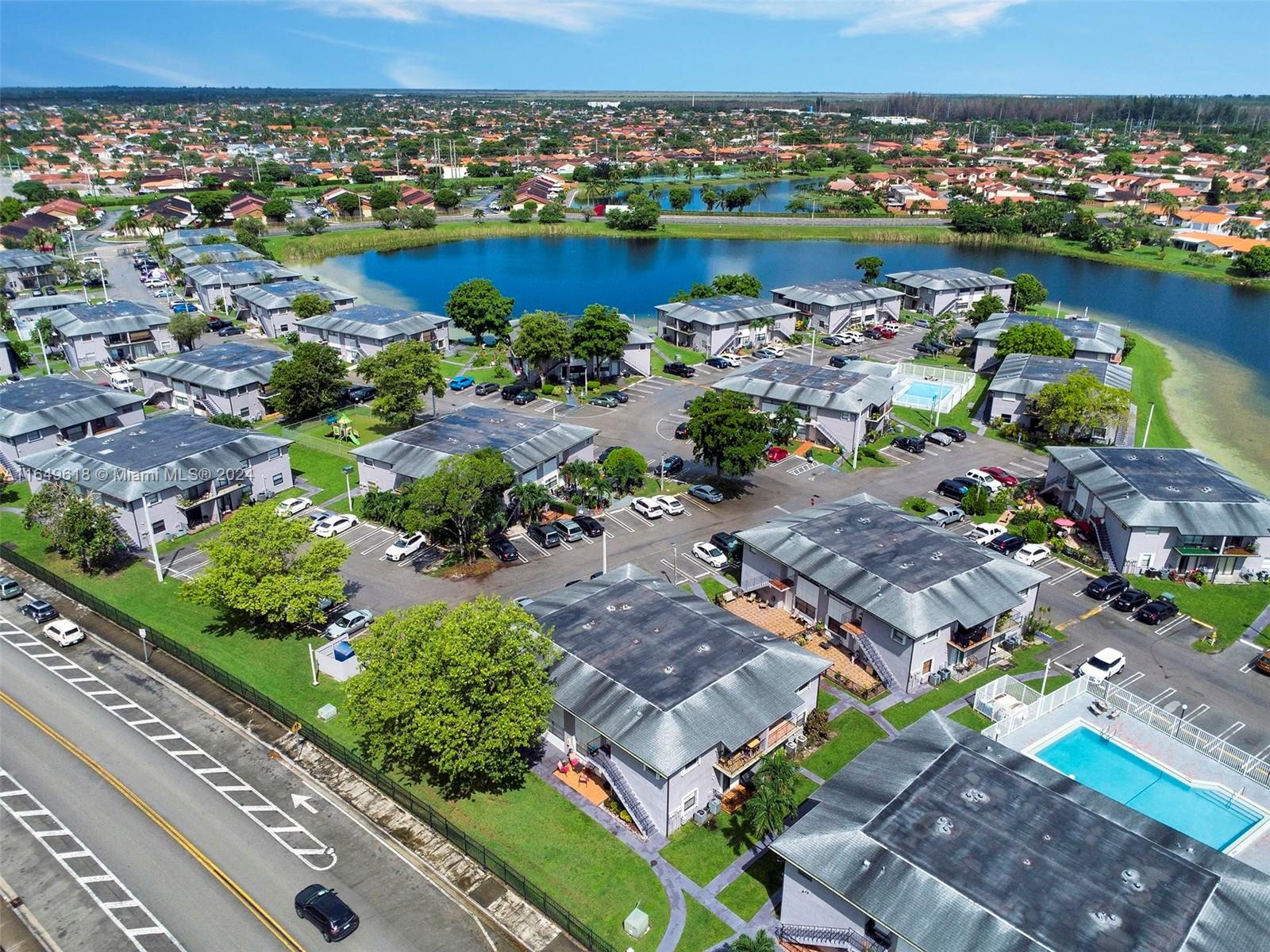 13240 Southwest 17th Lane, Unit 8 Miami, FL 33175 - Photo 14 of 14 an aerial view of a house with a lake view