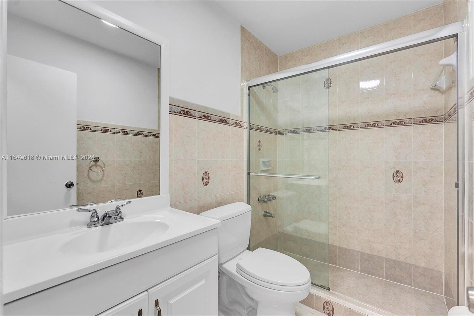 13240 Southwest 17th Lane, Unit 8 Miami, FL 33175 - Photo 6 of 14 a bathroom with a sink toilet and shower