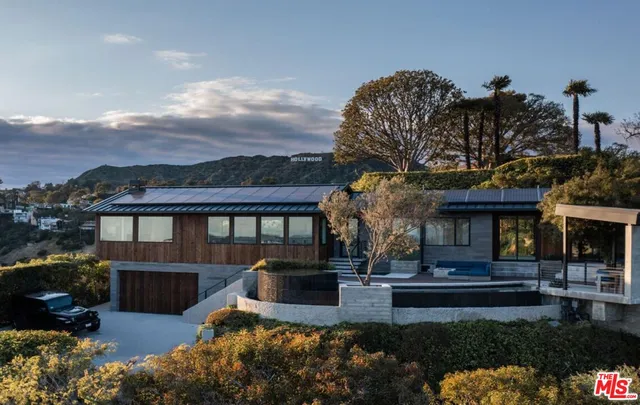 a view of a livingroom with furniture and a window