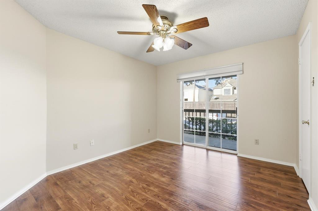18333 Roehampton Drive, Unit 716 Dallas, TX 75252 - Photo 11 of 24 wooden floor in an empty room with a window