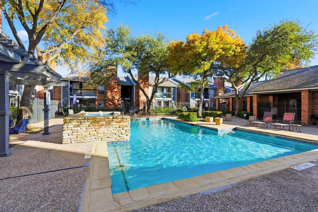 18333 Roehampton Drive, Unit 716 Dallas, TX 75252 - Photo 19 of 24 a view of a swimming pool with a patio