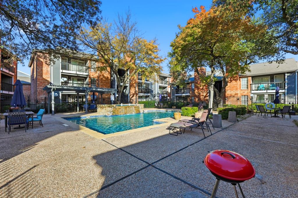 18333 Roehampton Drive, Unit 716 Dallas, TX 75252 - Photo 20 of 24 a backyard of a house with barbeque oven table and chairs