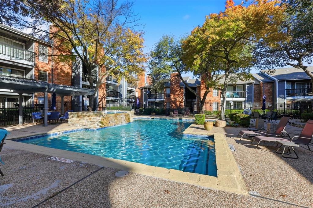 18333 Roehampton Drive, Unit 716 Dallas, TX 75252 - Photo 21 of 24 a view of a house with swimming pool and sitting area
