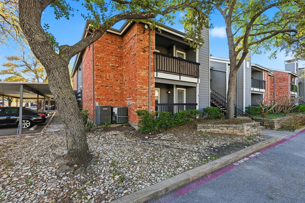 18333 Roehampton Drive, Unit 716 Dallas, TX 75252 - Photo 23 of 24 a view of a house with a yard