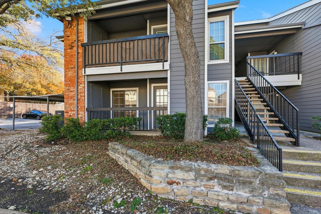 18333 Roehampton Drive, Unit 716 Dallas, TX 75252 - Photo 3 of 24 a front view of a house with stairway