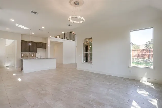 a view of kitchen with a sink and a window