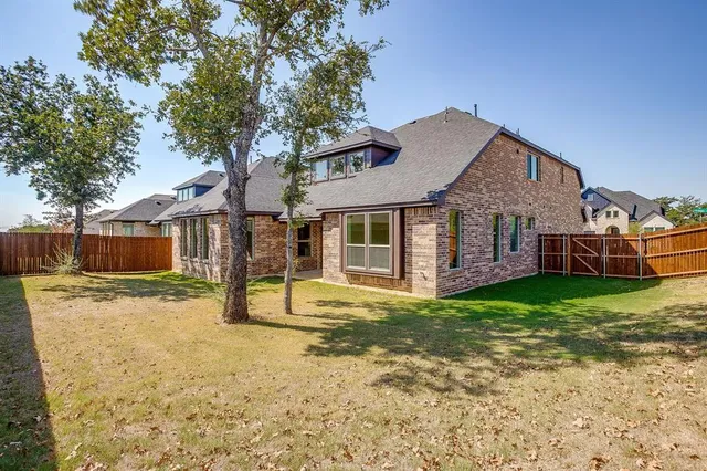 a house with trees in the background