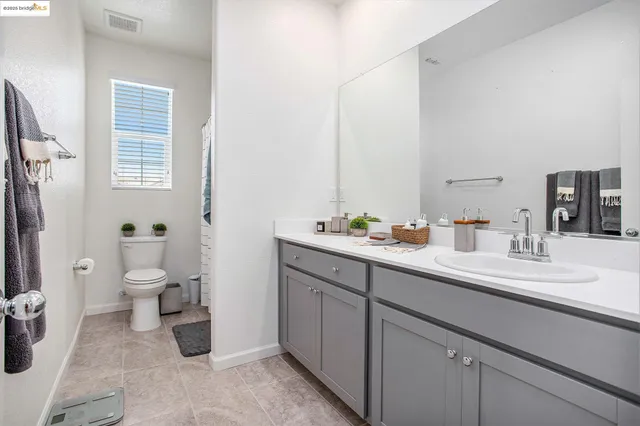 a bedroom with a bed and chair