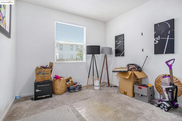 a bathroom with a granite countertop toilet sink and mirror