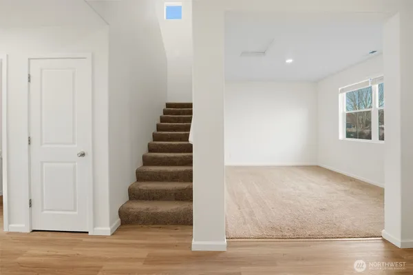 a view of an entryway with wooden floor