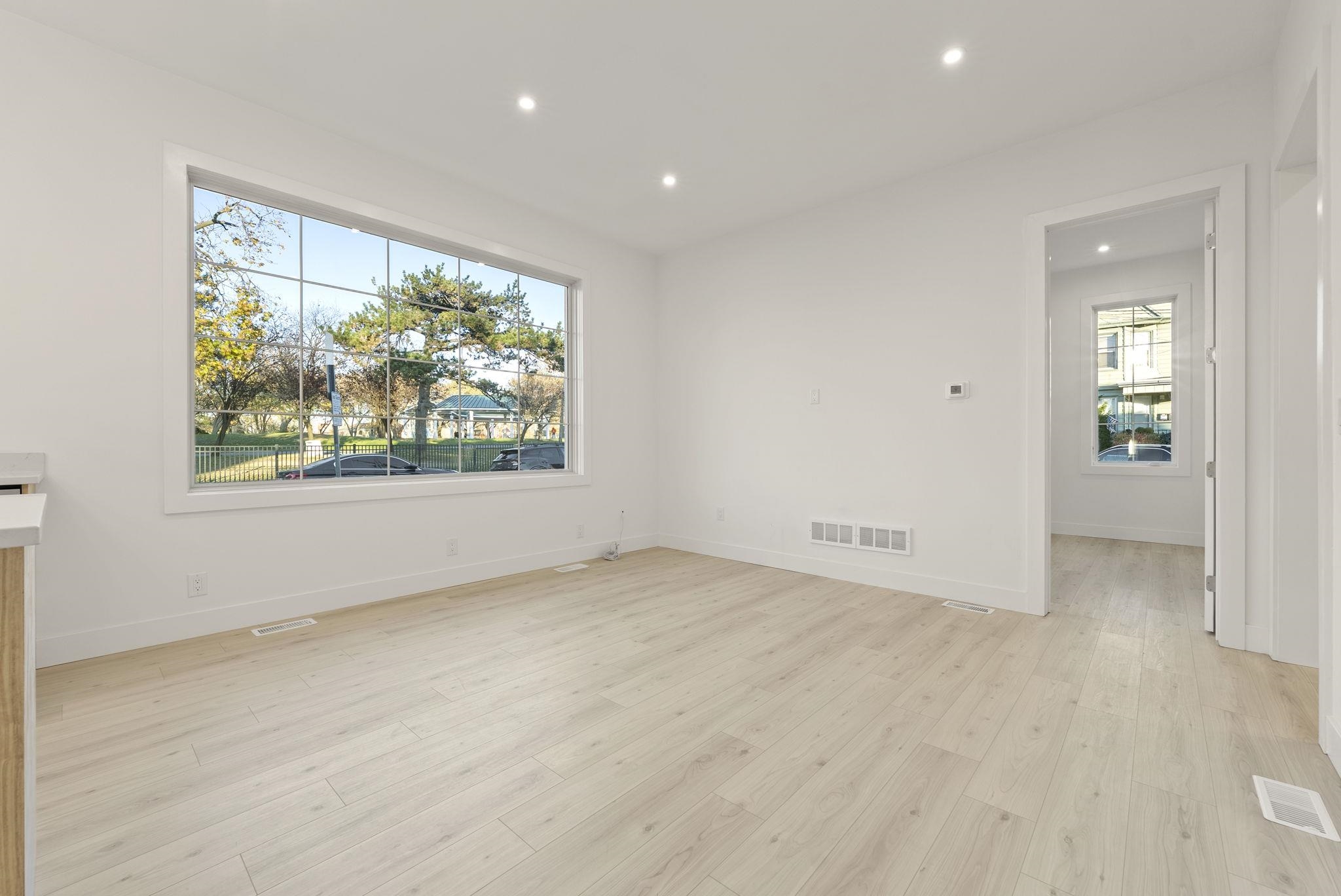 317 Sherman Avenue, Unit 1 Jersey City, NJ 07307 - Photo 17 of 29 an empty room with windows