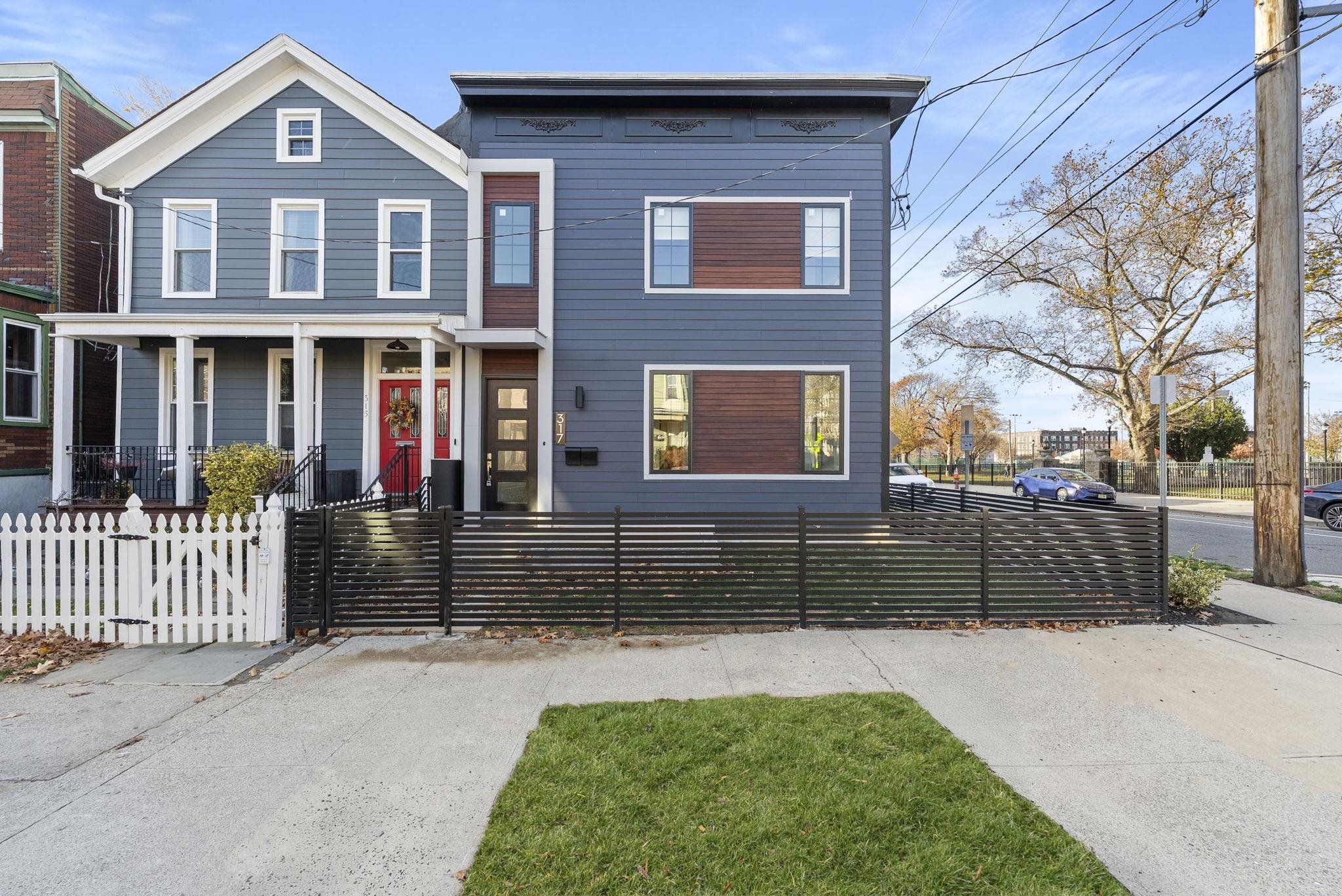 317 Sherman Avenue, Unit 1 Jersey City, NJ 07307 - Photo 2 of 29 a front view of a house with garden