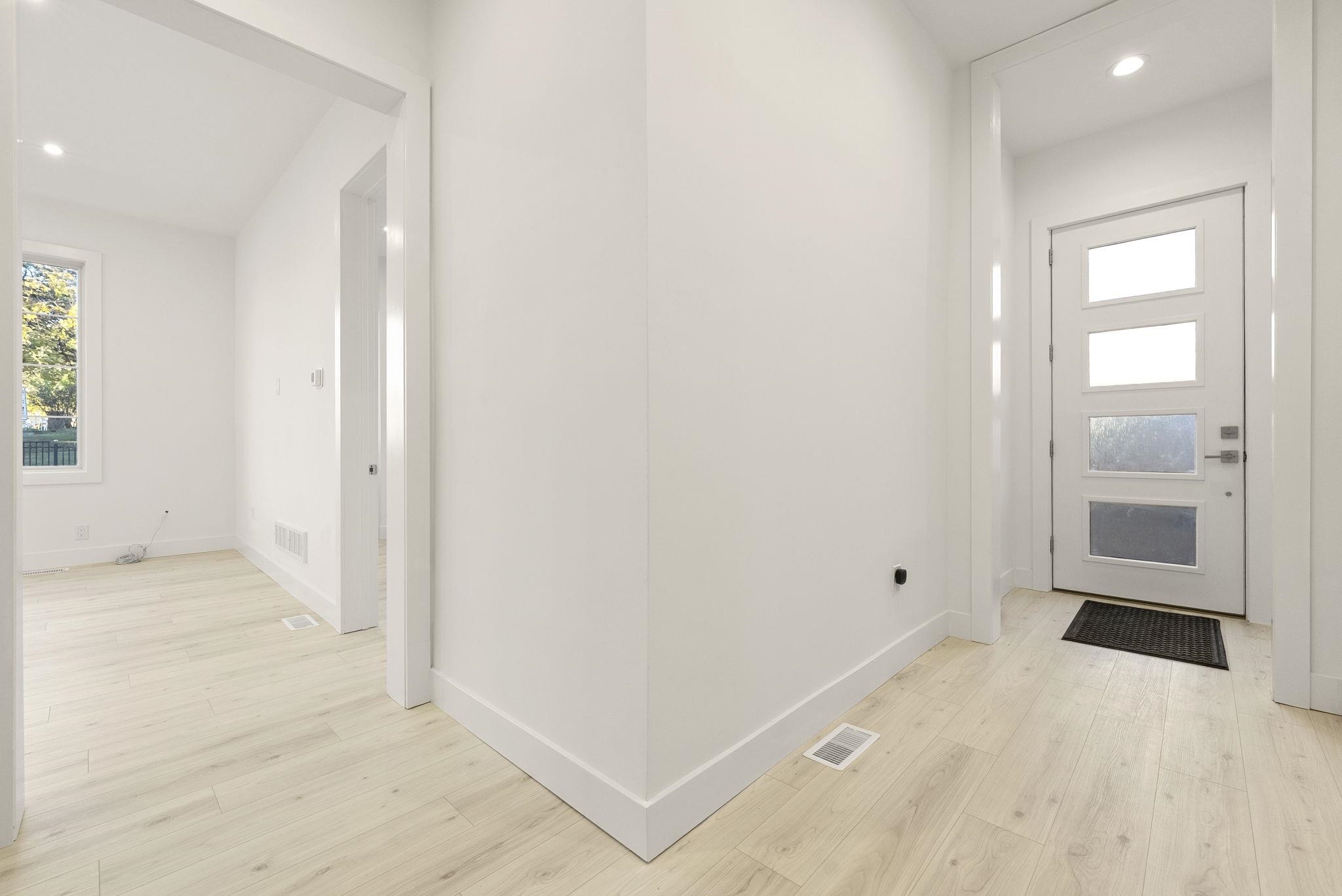 317 Sherman Avenue, Unit 1 Jersey City, NJ 07307 - Photo 25 of 29 an empty room with cabinet and mirrors