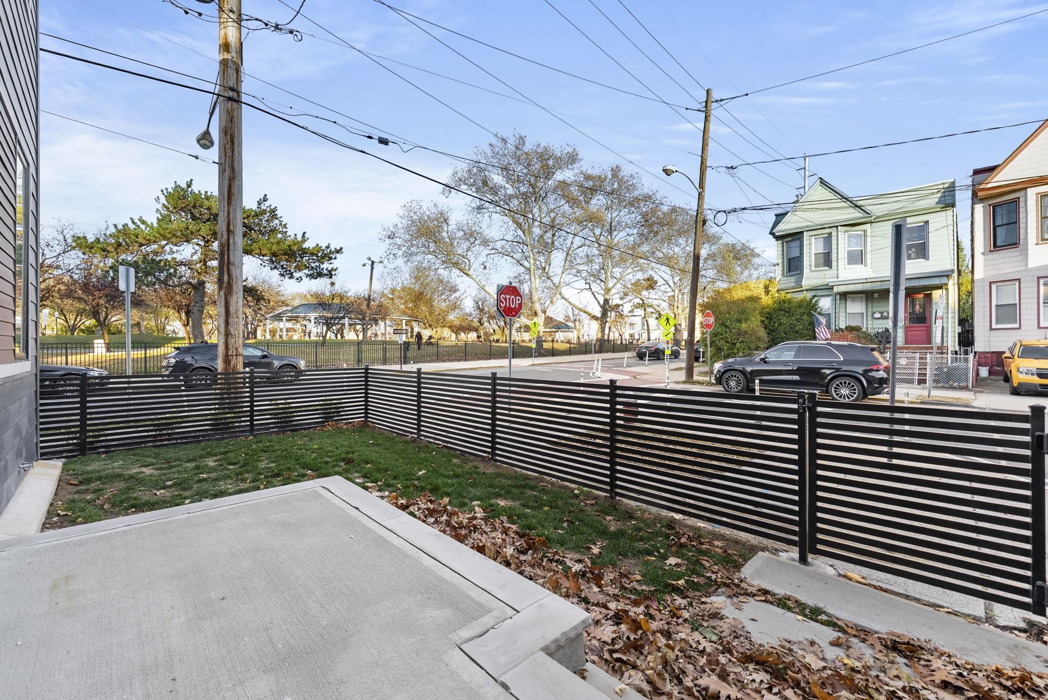 317 Sherman Avenue, Unit 1 Jersey City, NJ 07307 - Photo 26 of 29 a view of a street with flower plants