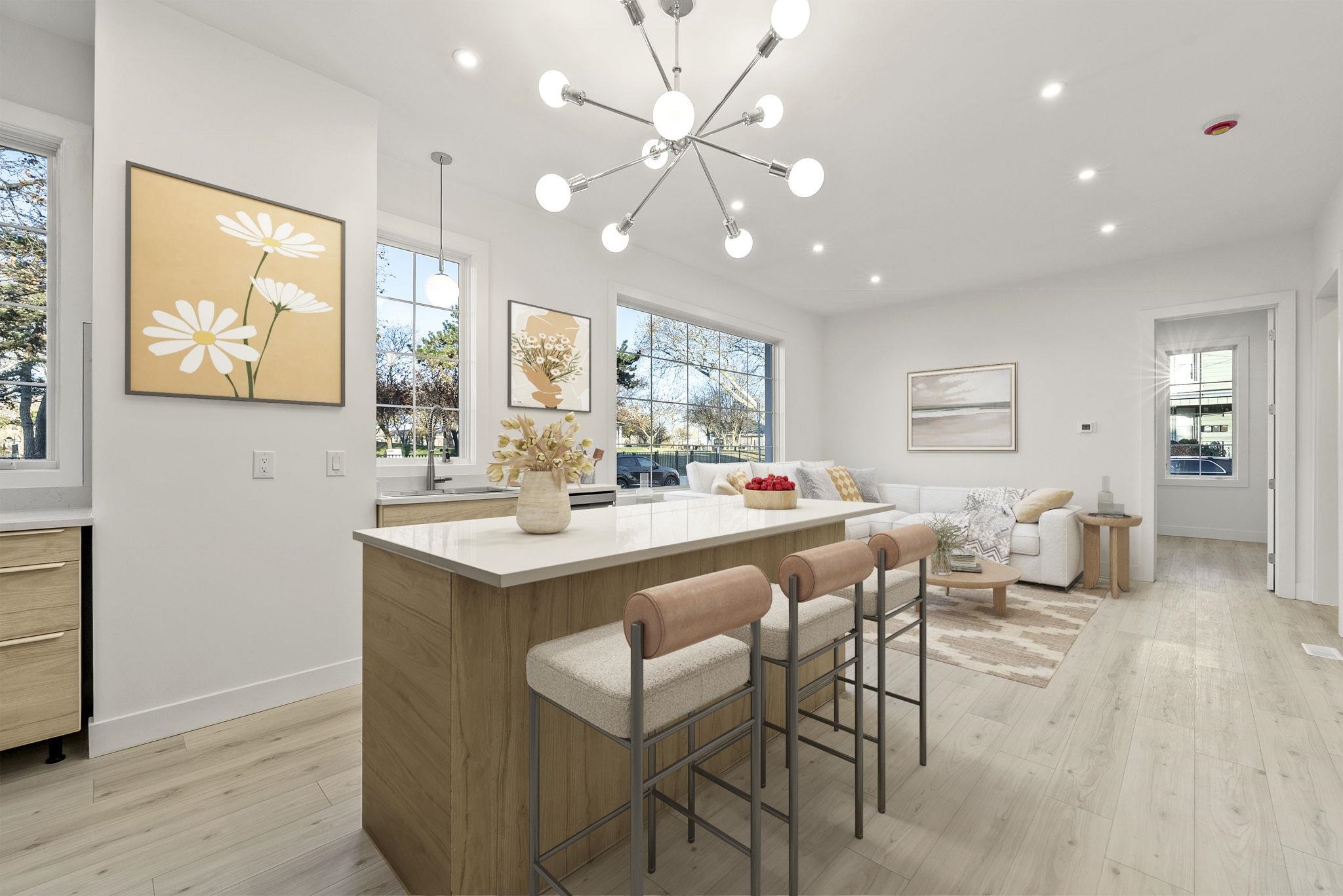 317 Sherman Avenue, Unit 1 Jersey City, NJ 07307 - Photo 4 of 29 a kitchen with a dining table chairs cabinets and stainless steel appliances