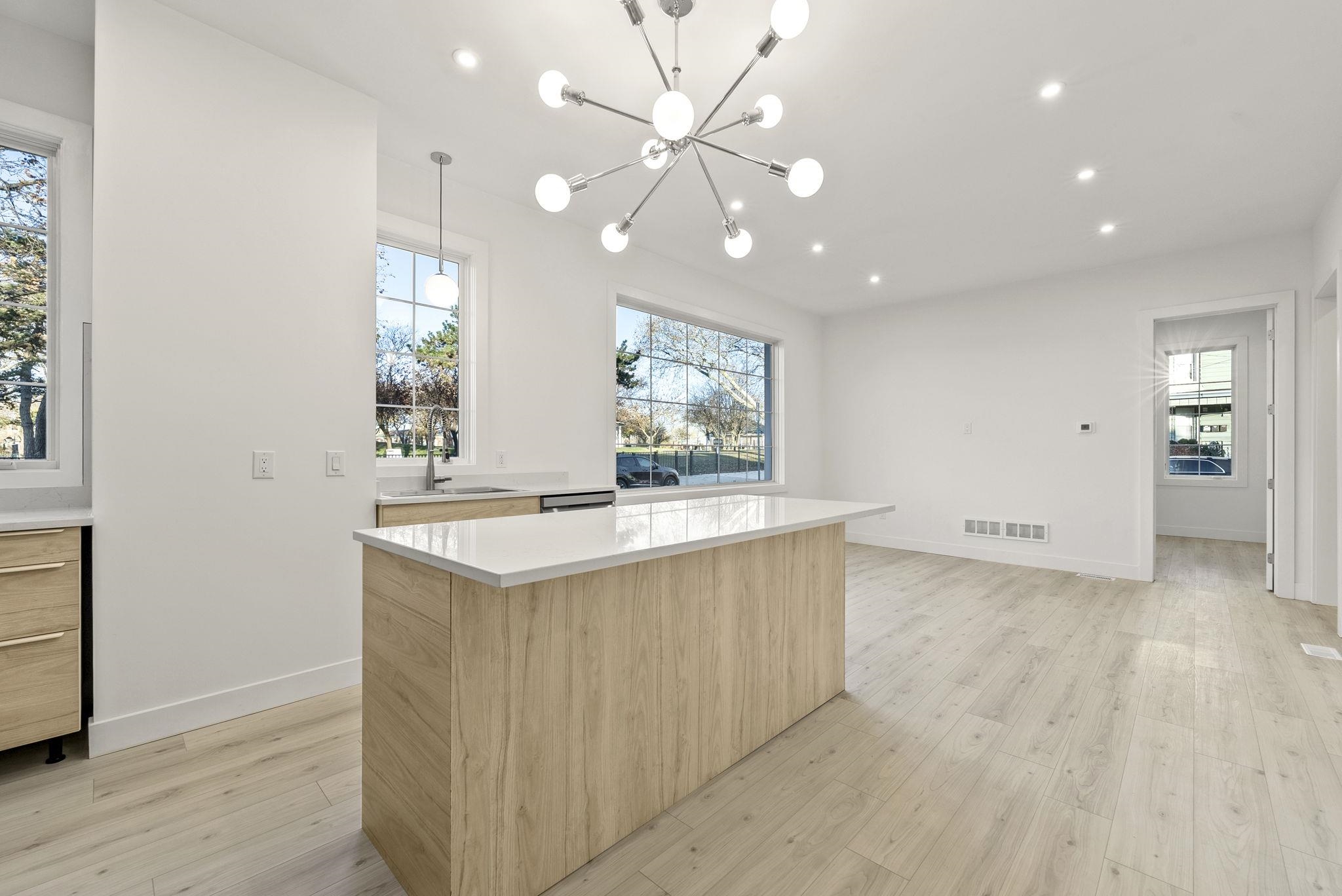 317 Sherman Avenue, Unit 1 Jersey City, NJ 07307 - Photo 5 of 29 a view of a kitchen with a sink and a window