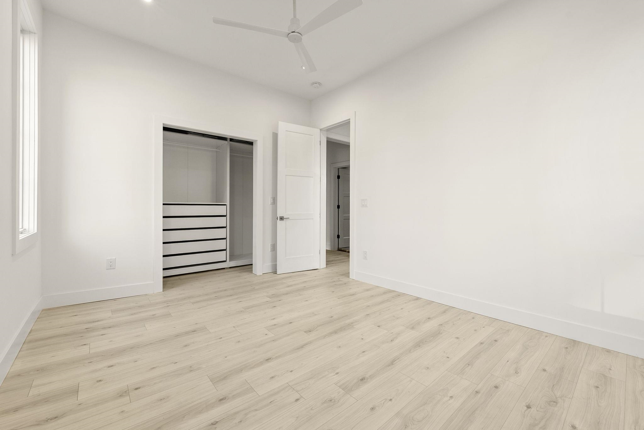 317 Sherman Avenue, Unit 1 Jersey City, NJ 07307 - Photo 7 of 29 a view of empty room with wooden floor