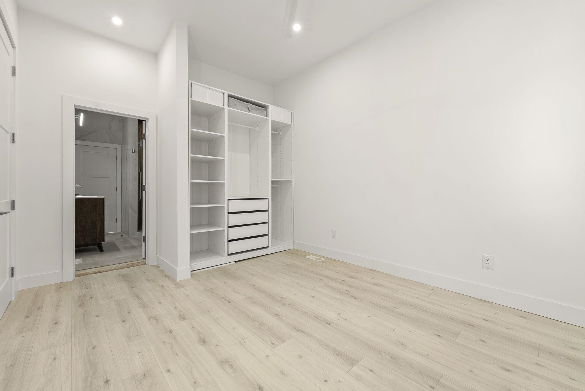 317 Sherman Avenue, Unit 1 Jersey City, NJ 07307 - Photo 9 of 29 a view of room with wooden floor and closet