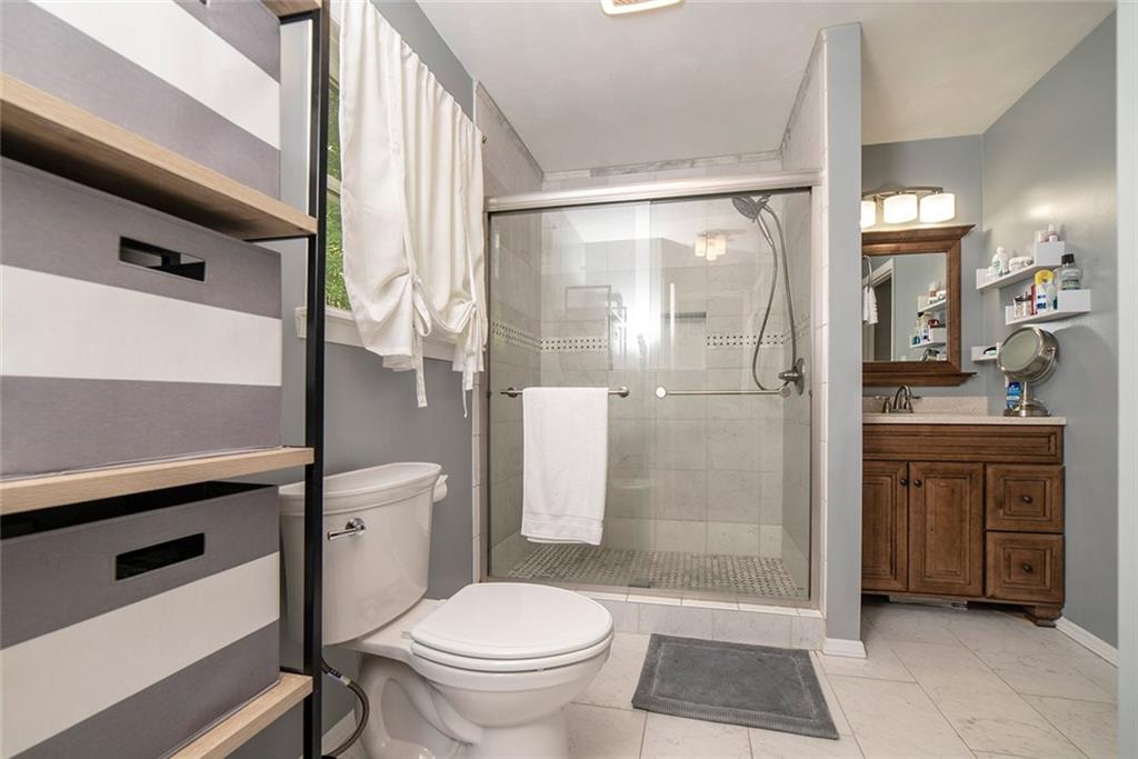 425 Marguerite Road Latrobe, PA 15650 - Photo 15 of 25 NEW CERAMIC OVERSIZED SHOWER WITH GLASS DOORS AND NEW CABINET, COUNTERTOP & FIXTURES.