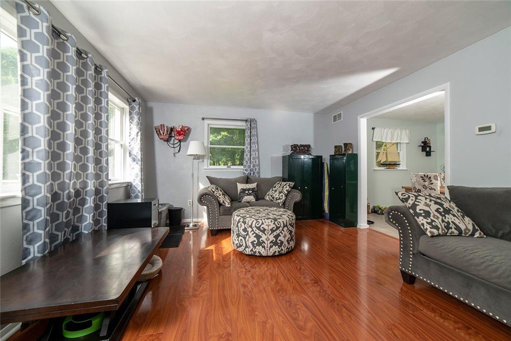 425 Marguerite Road Latrobe, PA 15650 - Photo 3 of 25 LIVING ROOM WITH GLEAMING FLOORS AND WEST FACING WINDOWS.