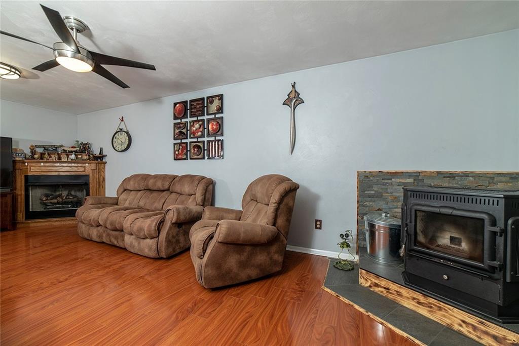 425 Marguerite Road Latrobe, PA 15650 - Photo 5 of 25 FAMILY ROOM WITH GAS FIREPLACE AND 4-FUEL STOVE.