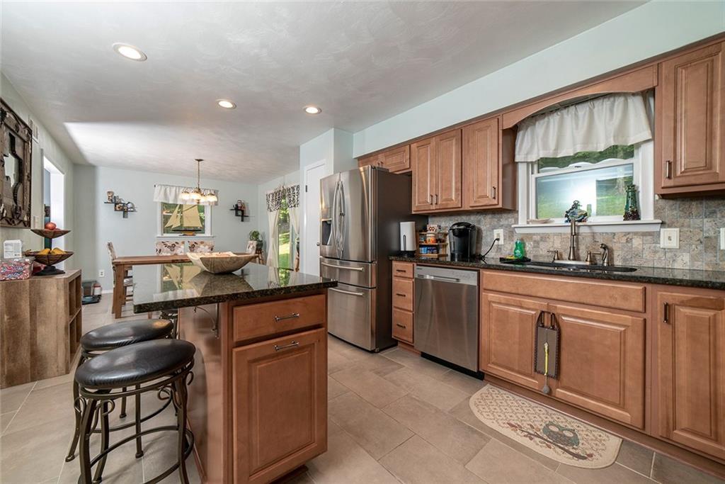 425 Marguerite Road Latrobe, PA 15650 - Photo 6 of 25 KITCHEN WITH OPEN CONCEPT TO DINING AREA AND ADJACENT DECK.