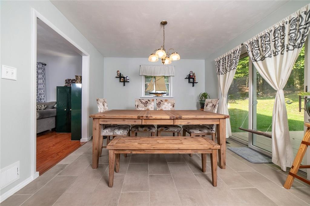 425 Marguerite Road Latrobe, PA 15650 - Photo 8 of 25 DINING AREA WITH NEW TILE FLOOR AND ACCESS TO ADJACENT DECK
