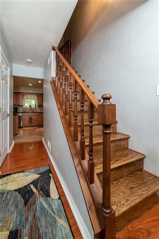 425 Marguerite Road Latrobe, PA 15650 - Photo 10 of 25 BEAUTIFUL HARDWOOD STAIRS TO UPPER LEVEL.