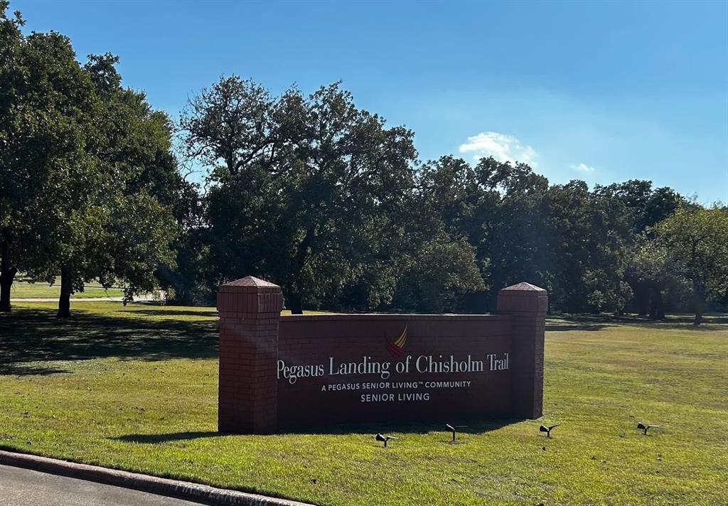 a view of swimming pool with a garden and trees