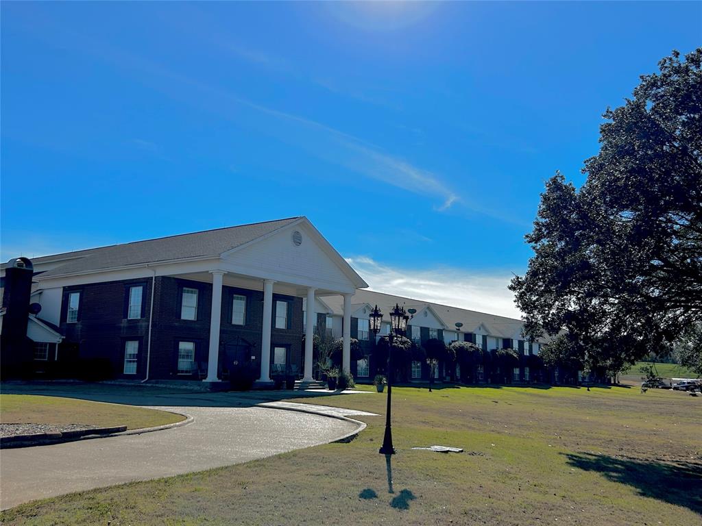501 South Old Betsy Road, Unit 28 Keene, TX 76059 - Photo 2 of 10 a front view of a house with a yard
