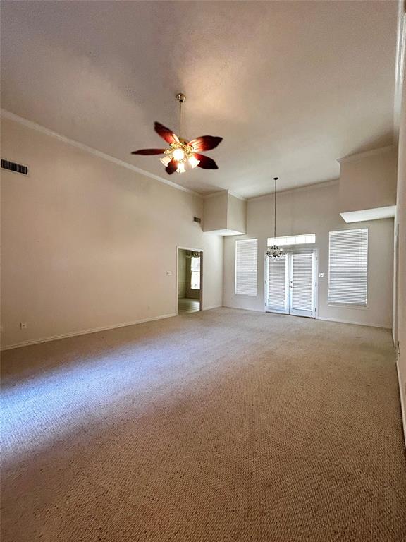 501 South Old Betsy Road, Unit 28 Keene, TX 76059 - Photo 5 of 10 an empty room with a ceiling fan and window