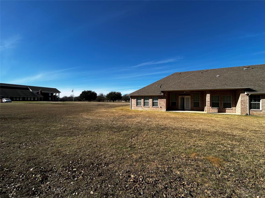 501 South Old Betsy Road, Unit 28 Keene, TX 76059 - Photo 10 of 10 a front view of a house with a yard