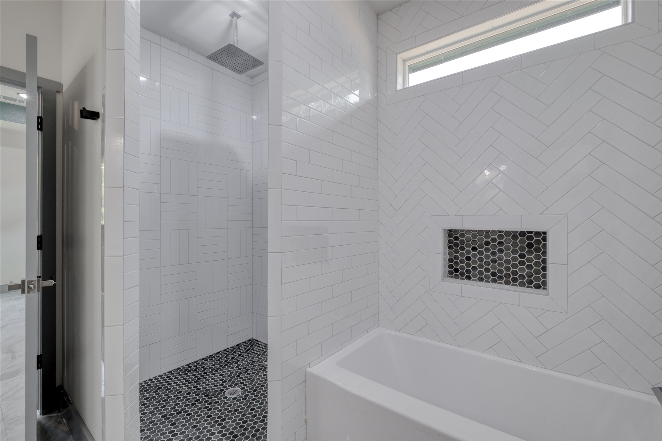 204 Washington Street Elgin, TX 78621 - Photo 12 of 24 a bathroom with a shower and a bath tub