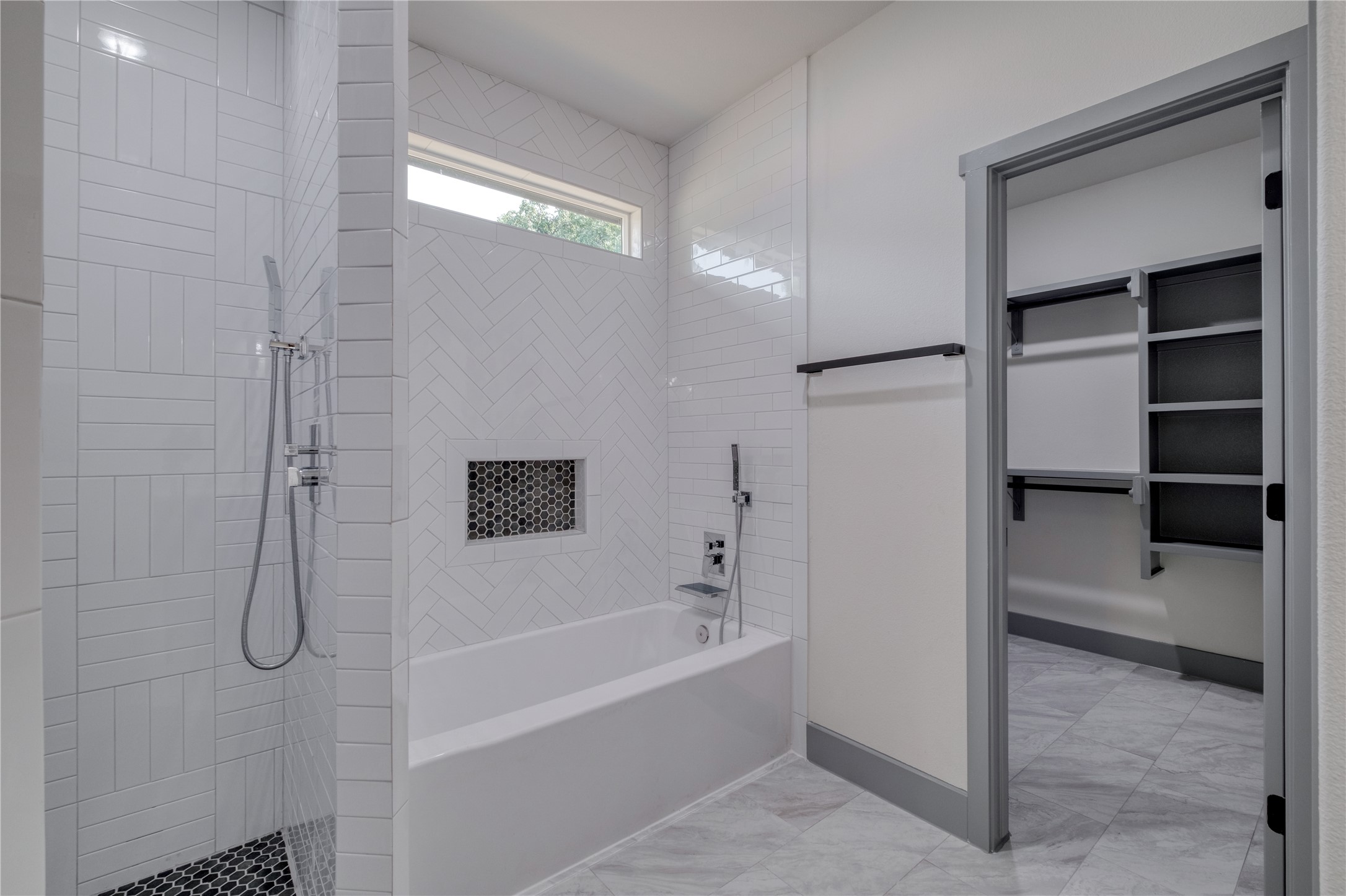 204 Washington Street Elgin, TX 78621 - Photo 13 of 24 a bathroom with a bathtub and a shower