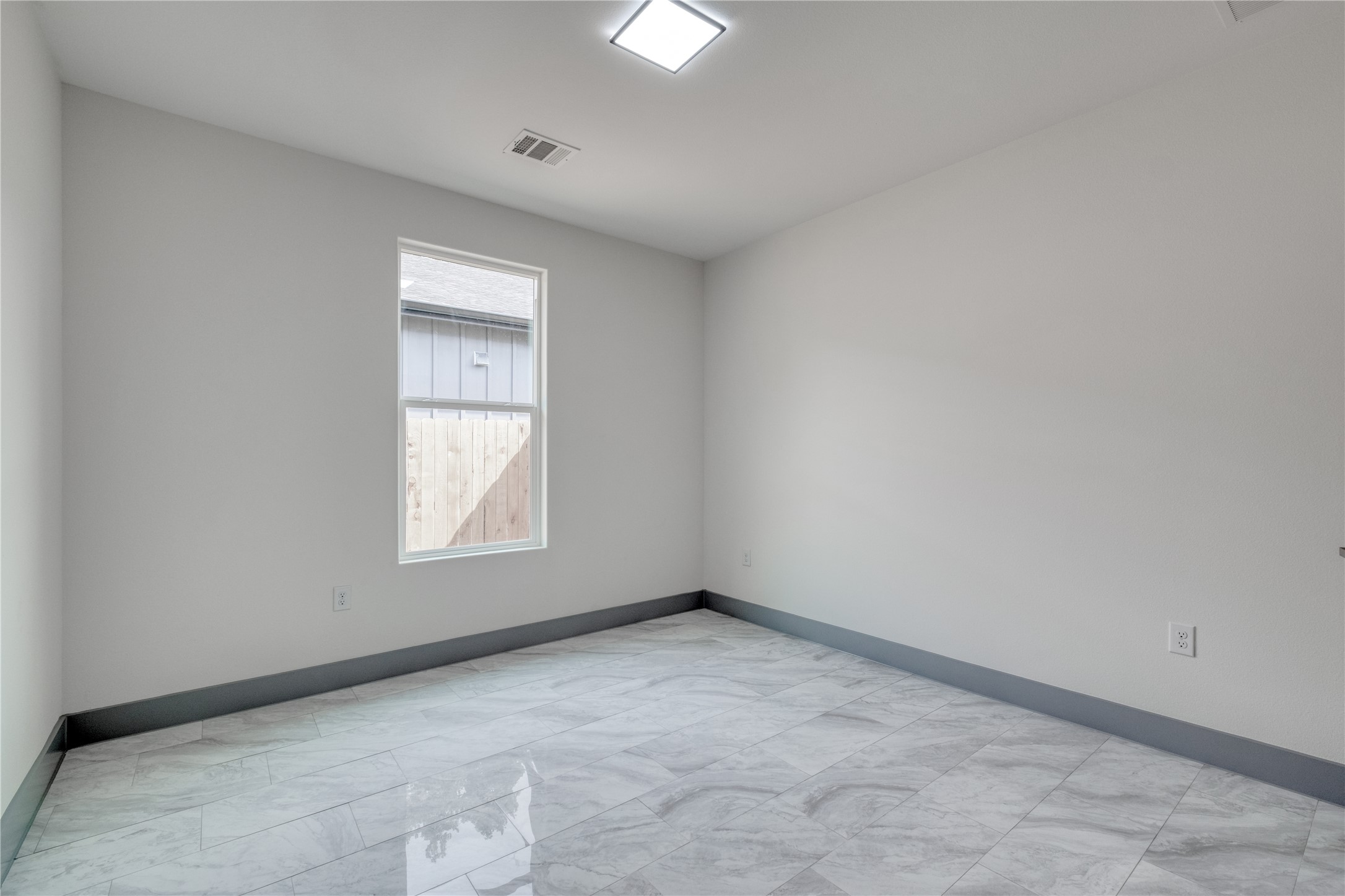 204 Washington Street Elgin, TX 78621 - Photo 16 of 24 an empty room with a window