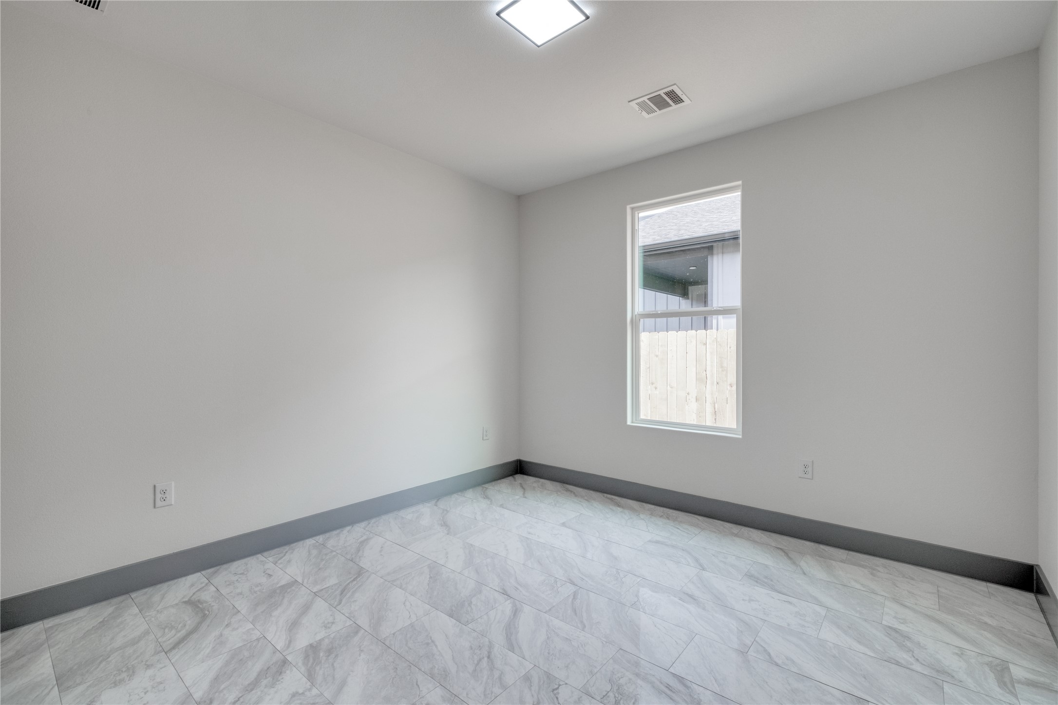 204 Washington Street Elgin, TX 78621 - Photo 17 of 24 a view of an empty room with a window