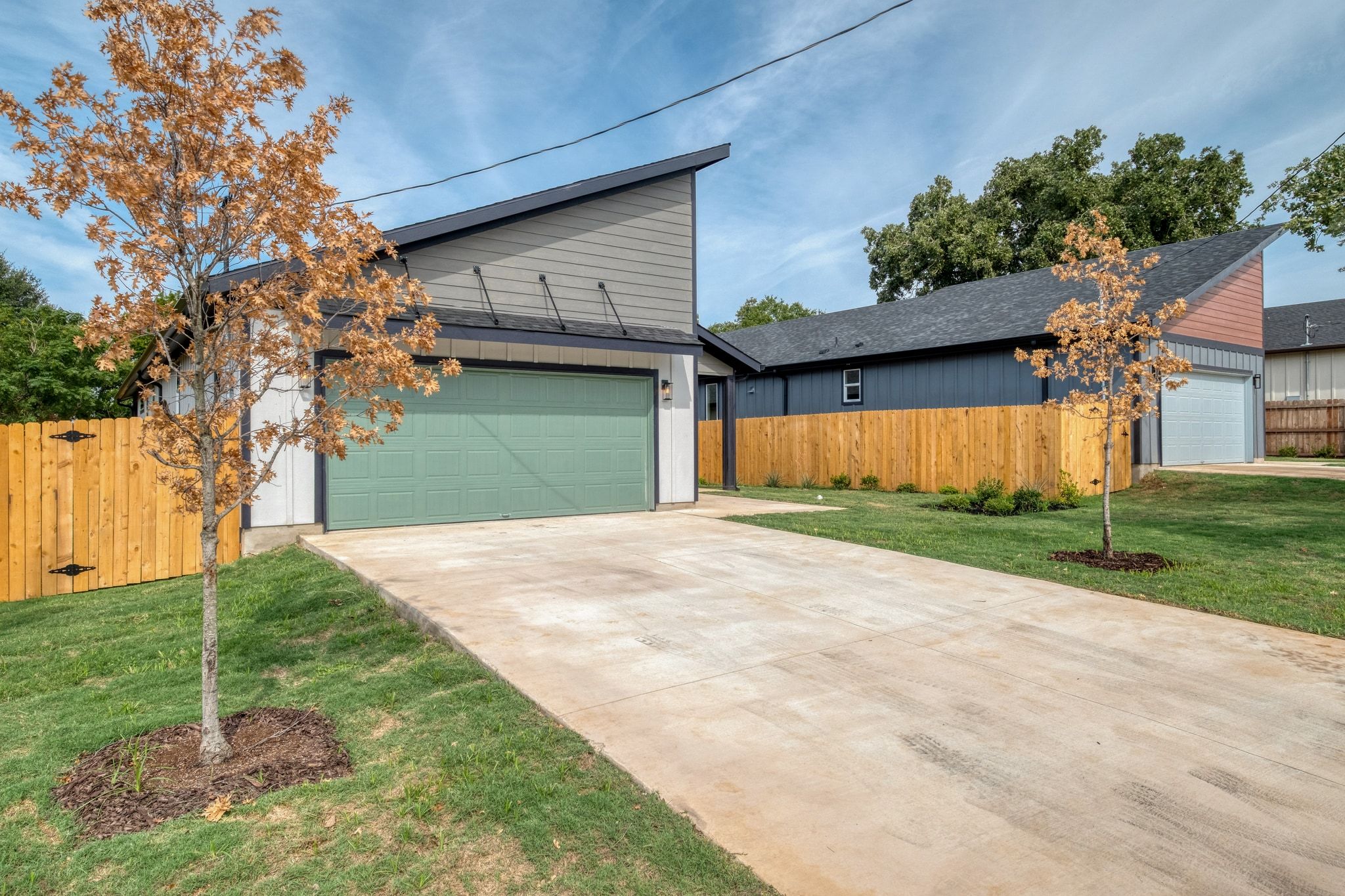 204 Washington Street Elgin, TX 78621 - Photo 2 of 24 a front view of a house with garden