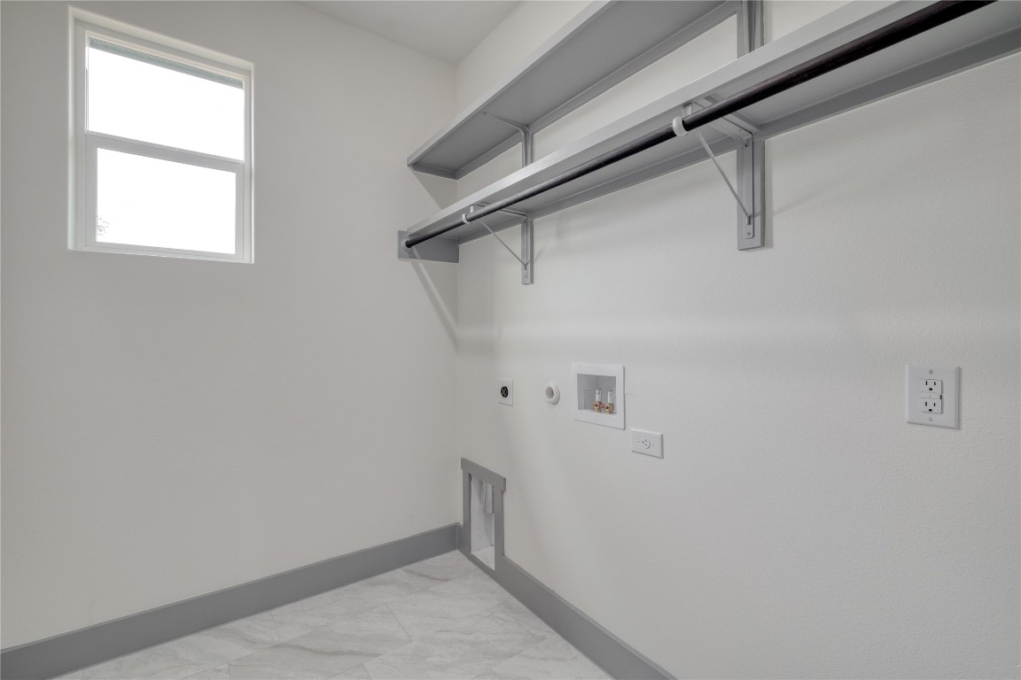 204 Washington Street Elgin, TX 78621 - Photo 20 of 24 Laundry room with storage