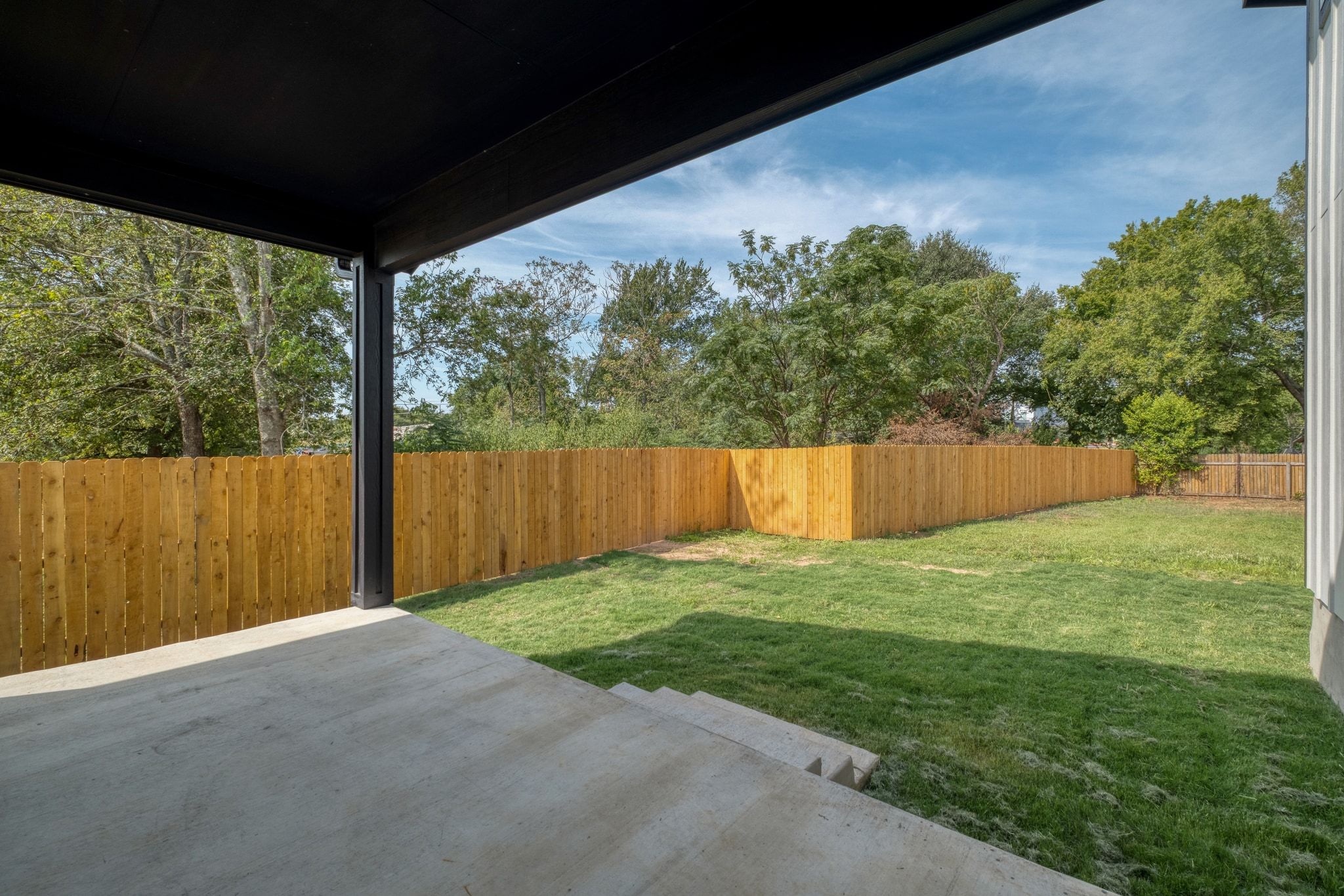 204 Washington Street Elgin, TX 78621 - Photo 21 of 24 a view of a backyard with a tree
