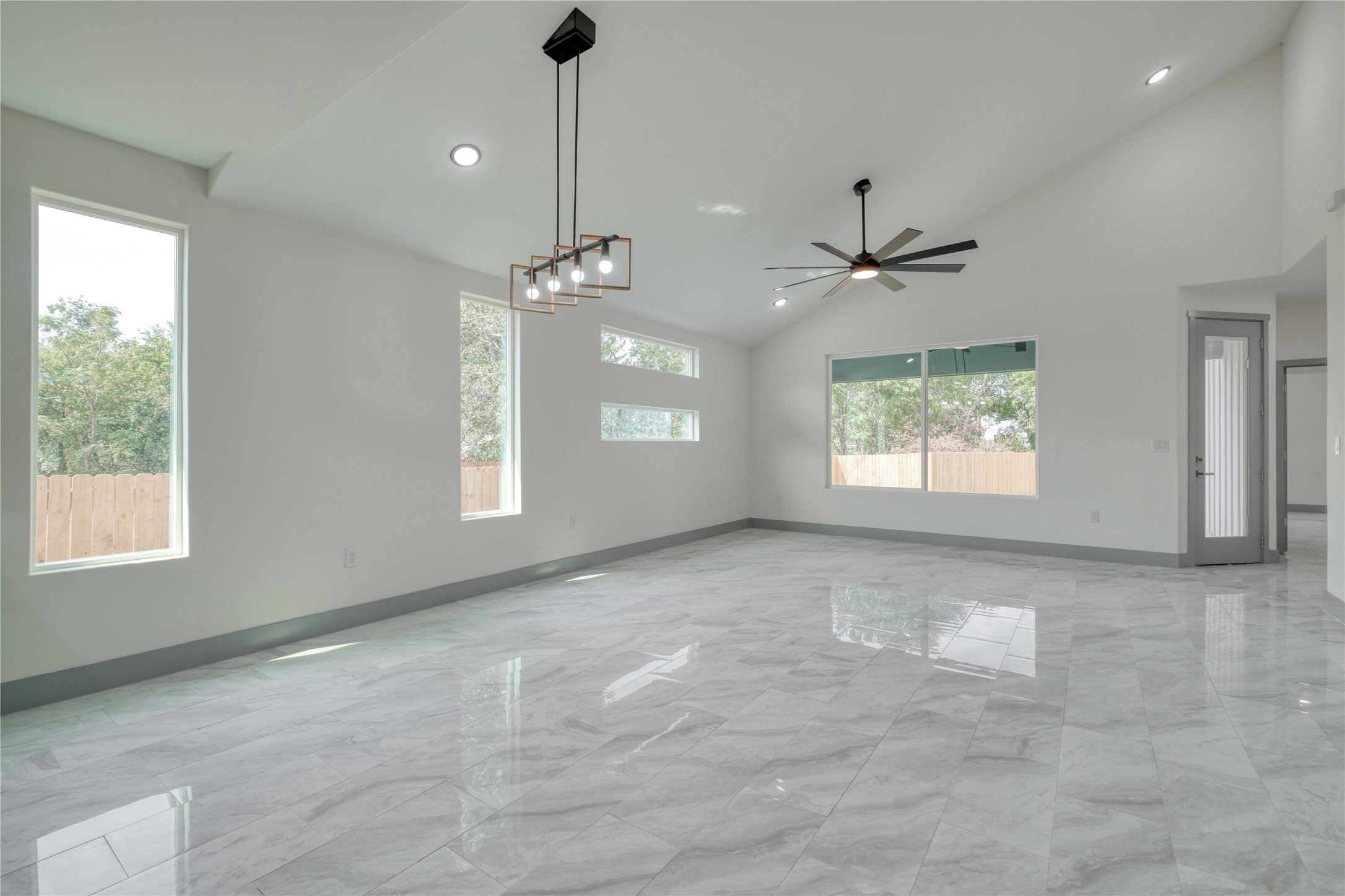 204 Washington Street Elgin, TX 78621 - Photo 7 of 24 a view of an empty room with a window