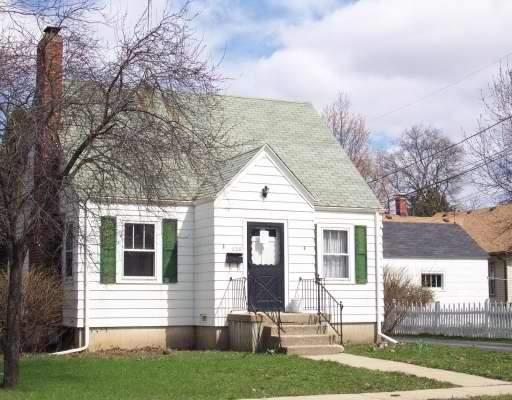 638 Summit Street Elgin, IL 60120 - Photo 1 of 1 a front view of a house with a yard