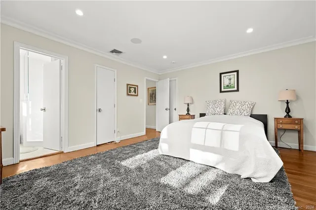 a spacious bedroom with a bed and a table